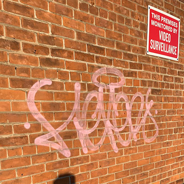 Graffiti removal on brick-before